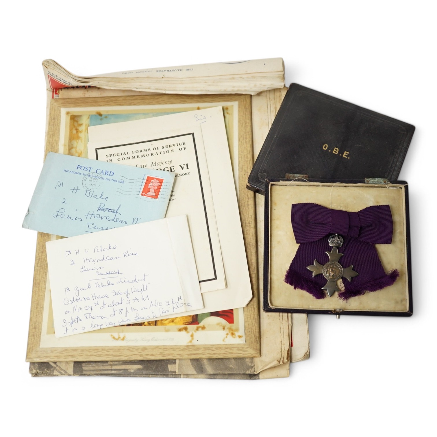 A civilian OBE with ladies bow ribbon, hallmarked for London 1929 in a Garrard’s fitted case, together with a small collection of Royal memorabilia relating to the coronation and death of George VI. Condition - fair, hin